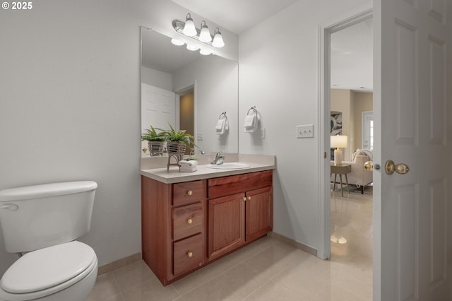 30326 SW Ruth St Unit 58, Wilsonville, OR 97070 - bathroom with tile patterned flooring, baseboards, toilet, and vanity