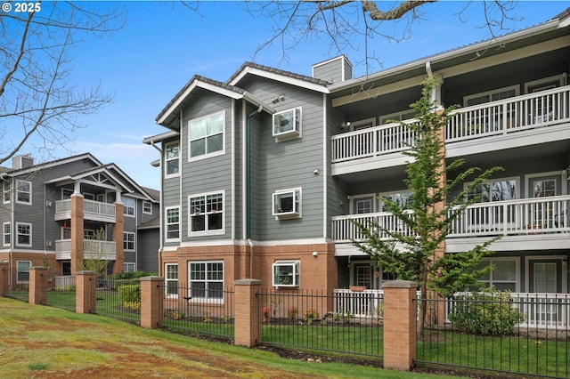 30326 SW Ruth St Unit 58, Wilsonville, OR 97070 - view of building exterior with a fenced front yard