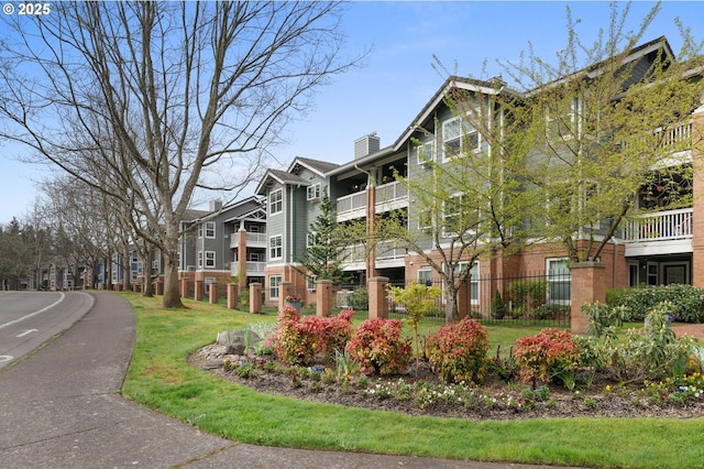30326 SW Ruth St Unit 58, Wilsonville, OR 97070 - view of building exterior with a residential view and fence