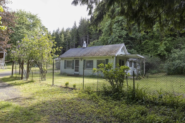 18570 Oakdale Rd, Dallas, OR 97338 - view of front of property featuring a chimney and a wooded view