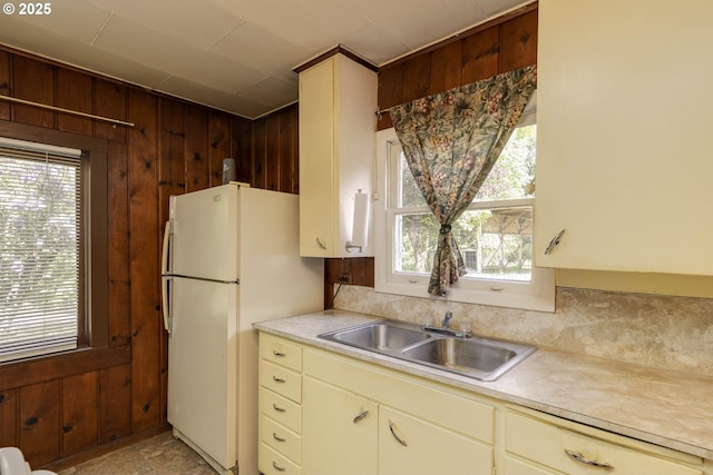 18570 Oakdale Rd, Dallas, OR 97338 - kitchen with a sink, wood walls, light countertops, healthy amount of natural light, and cream cabinets