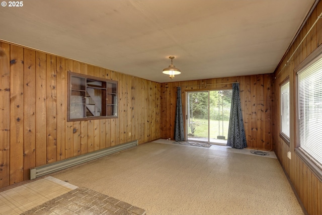 18570 Oakdale Rd, Dallas, OR 97338 - spare room with a baseboard heating unit and wooden walls