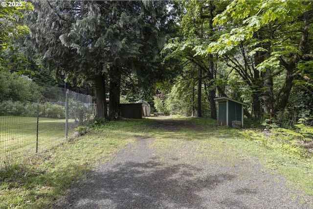 18570 Oakdale Rd, Dallas, OR 97338 - view of yard with a shed, fence, and an outbuilding