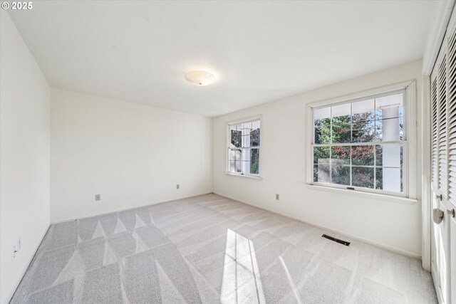 4401 SW Westdale Dr, Portland, OR 97221 - spare room with carpet flooring, visible vents, and baseboards