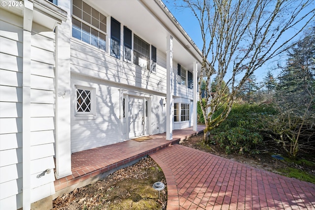 exterior space featuring brick siding