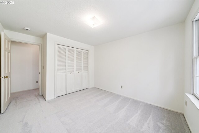 4401 SW Westdale Dr, Portland, OR 97221 - unfurnished bedroom featuring light colored carpet, a closet, and baseboards