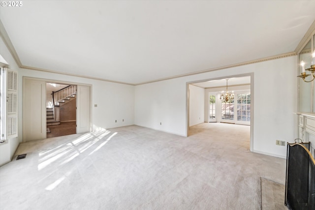 unfurnished living room with a chandelier, crown molding, and light carpet