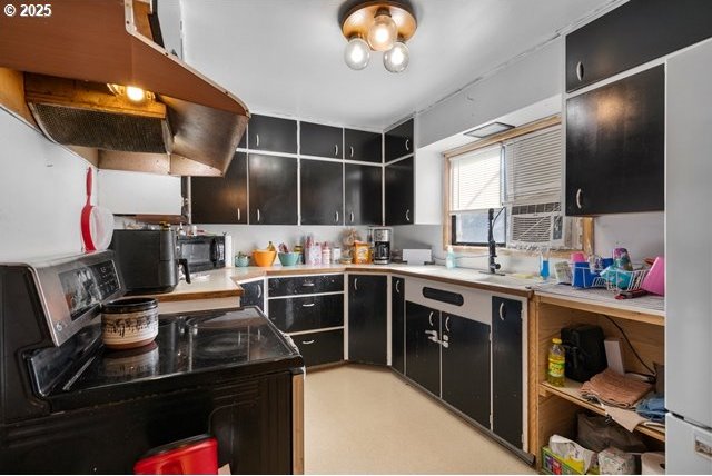 kitchen featuring dark cabinets, open shelves, cooling unit, range with electric cooktop, and light countertops