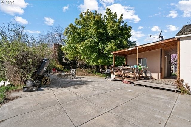 view of patio with a wooden deck