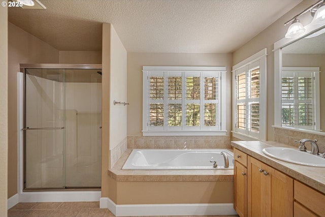 full bath featuring vanity, a shower stall, and a bath