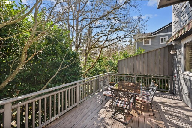 wooden deck with outdoor dining area
