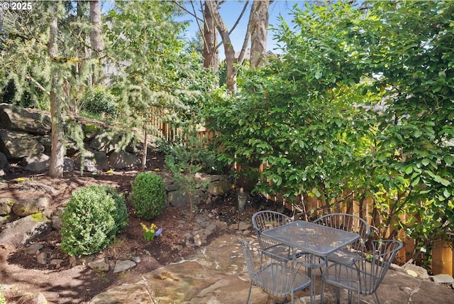 view of patio / terrace with outdoor dining area and fence