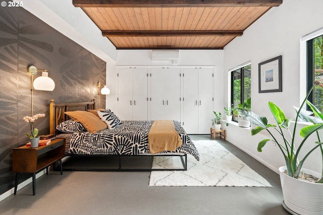 3777 Parkwood Way W, Linn, OR 97068 - bedroom featuring wooden ceiling with exposed beams, finished concrete floors, and a wall mounted AC