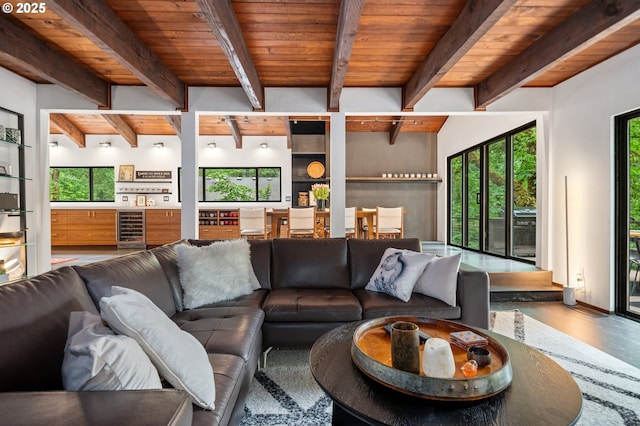 3777 Parkwood Way W, Linn, OR 97068 - living area with wine cooler, wooden ceiling with exposed beams, and wood finished floors