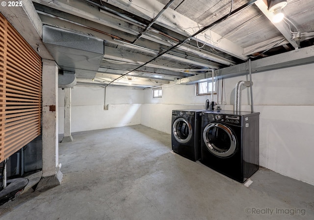 below grade area with washing machine and clothes dryer