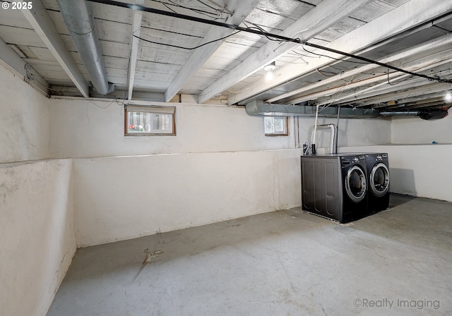 basement featuring washer and clothes dryer and a healthy amount of sunlight