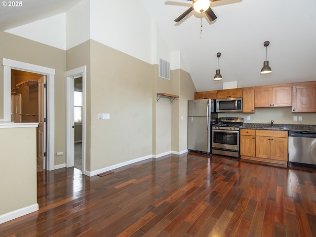 kitchen with visible vents, dark countertops, appliances with stainless steel finishes, ceiling fan, and dark wood-style flooring