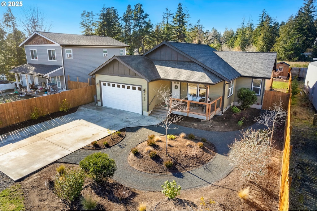 view of front of house featuring a garage and covered porch