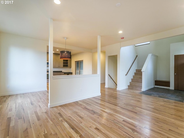 unfurnished living room featuring light wood-style floors and recessed lighting