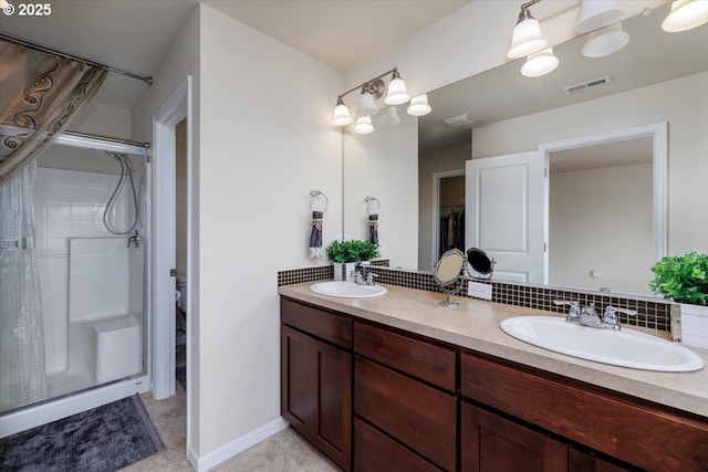 bathroom featuring vanity, toilet, an enclosed shower, and backsplash