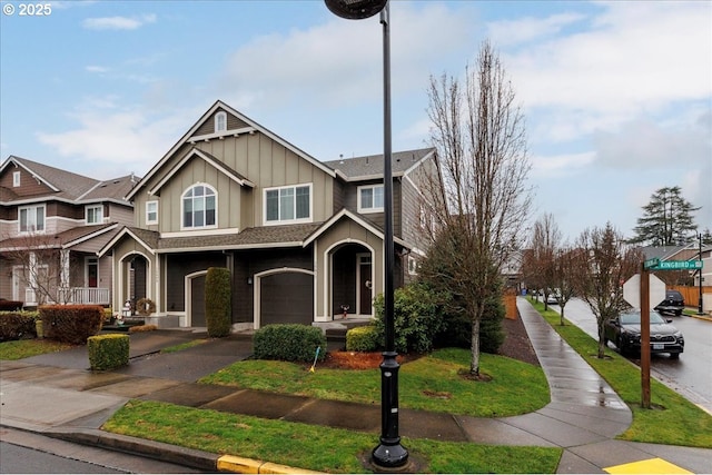 view of front of house featuring a garage and a front yard