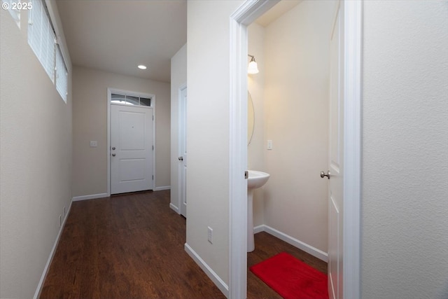 hallway featuring dark hardwood / wood-style flooring