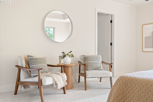 bedroom with baseboards and carpet