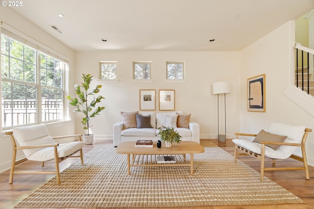 living room with wood finished floors and baseboards