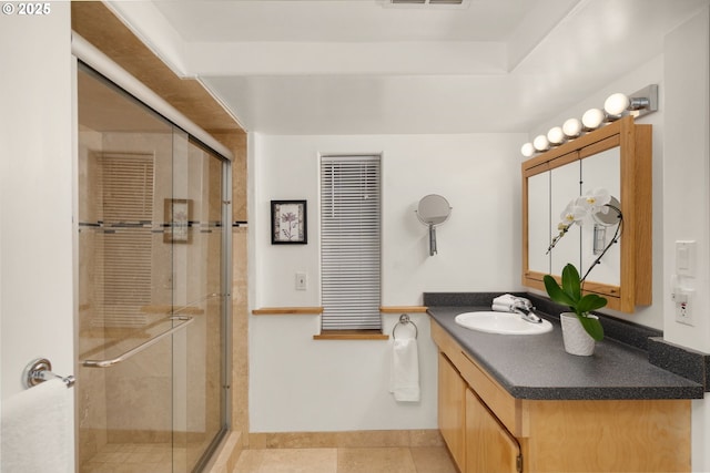 9990 SW Morrison St, Portland, OR 97225 - full bathroom with a stall shower, vanity, tile patterned floors, and baseboards