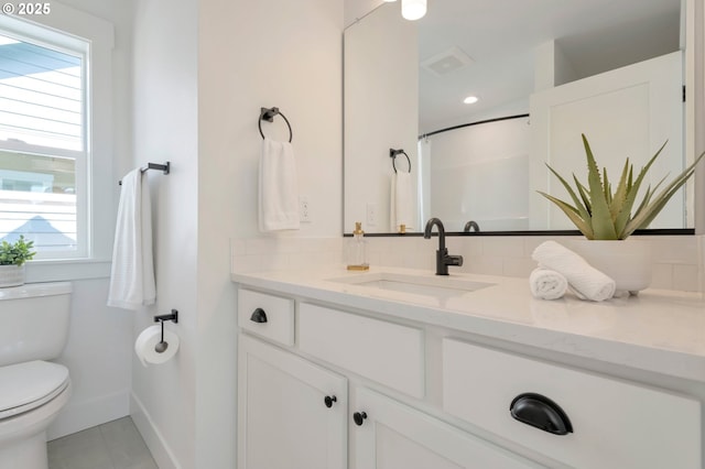 7257 SE Duke St Unit 3, Portland, OR 97206 - full bath featuring toilet, vanity, baseboards, tile patterned floors, and a shower with curtain