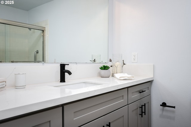 full bathroom with a stall shower and vanity