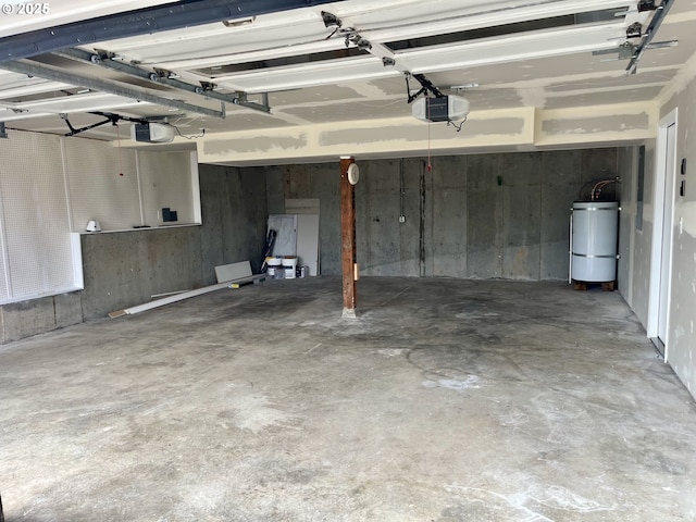 garage featuring secured water heater and a garage door opener