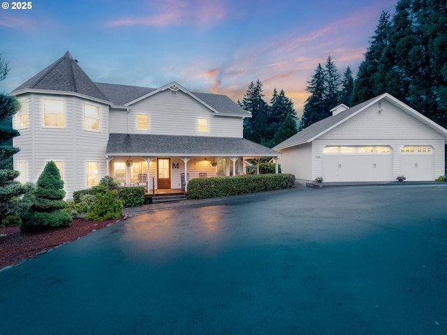 745 S 21st Pl, Ridgefield, WA 98642 - view of front of home with a porch, a shingled roof, and an outdoor structure