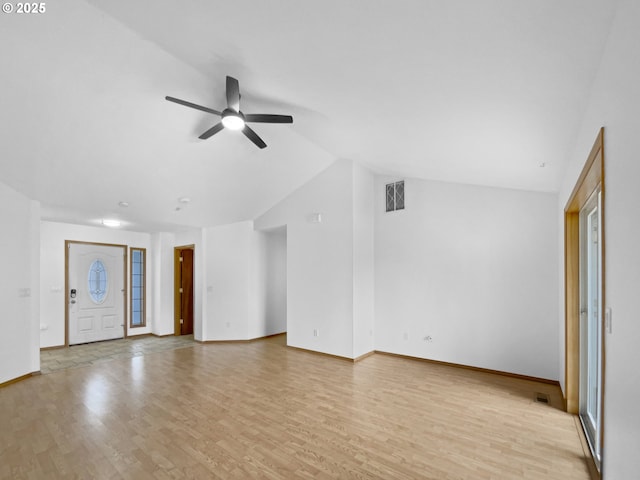 unfurnished living room with ceiling fan, lofted ceiling, visible vents, and light wood-style floors