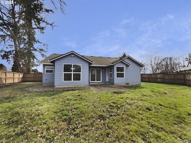 rear view of property featuring a patio area, a fenced backyard, and a lawn