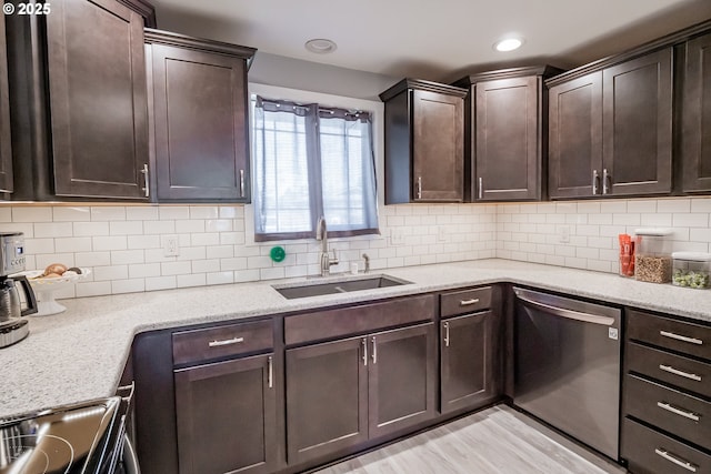 4260 Murnane St, Eugene, OR 97402 - kitchen featuring backsplash, dark brown cabinetry, stainless steel dishwasher, and a sink