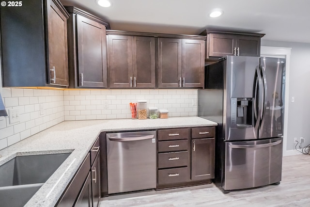 4260 Murnane St, Eugene, OR 97402 - kitchen featuring dark brown cabinetry, stainless steel appliances, light wood-type flooring, and recessed lighting