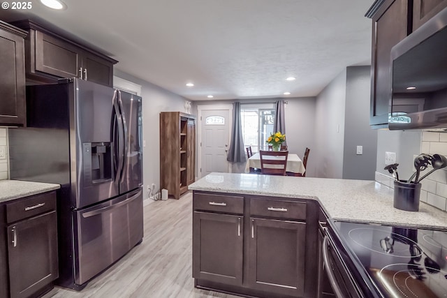 4260 Murnane St, Eugene, OR 97402 - kitchen featuring backsplash, appliances with stainless steel finishes, and dark brown cabinetry