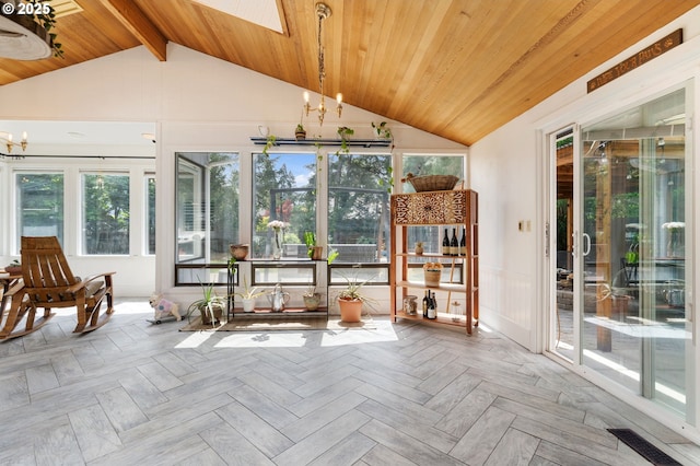 unfurnished sunroom with an inviting chandelier, wood ceiling, lofted ceiling with skylight, and visible vents