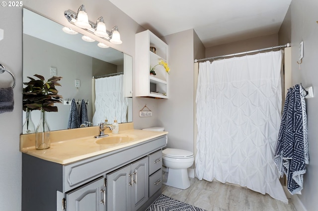 bathroom with vanity, a shower with curtain, and toilet