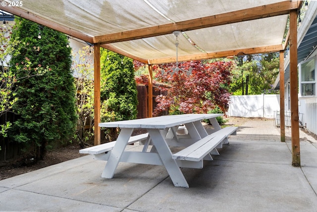 view of patio / terrace featuring fence and outdoor dining area