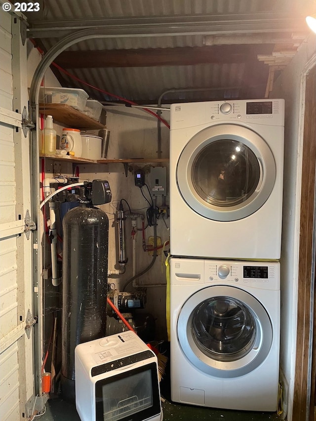 laundry room with stacked washer and clothes dryer