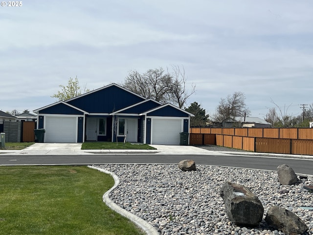 ranch-style home with fence, driveway, a front yard, and a garage