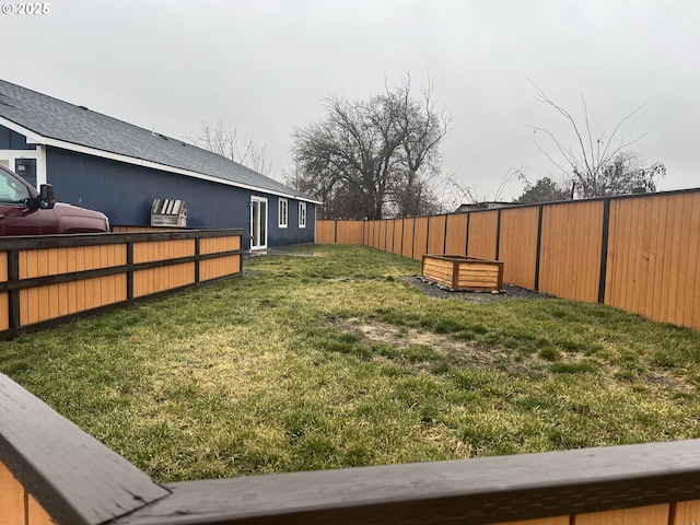 view of yard featuring a fenced backyard