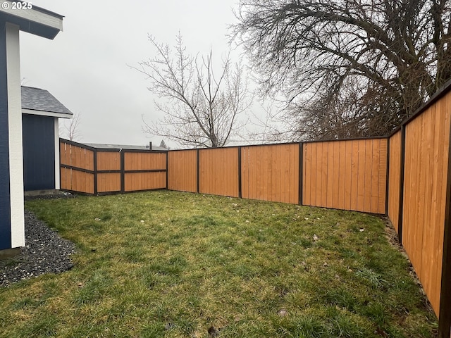 view of yard with a fenced backyard