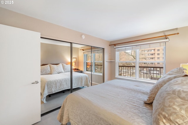 carpeted bedroom with a closet