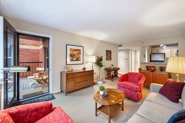 carpeted living room featuring a fireplace