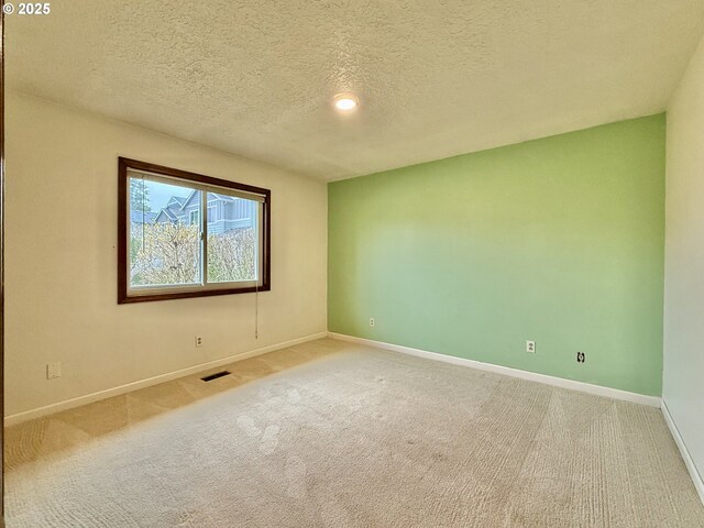 5207 NE 56th Way, Vancouver, WA 98661 - empty room with carpet, baseboards, and a textured ceiling