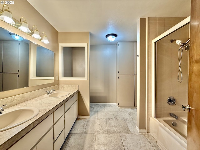 full bath with double vanity, shower / tub combination, baseboards, and a sink