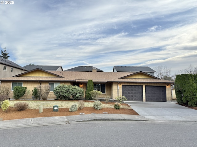 5207 NE 56th Way, Vancouver, WA 98661 - ranch-style home with a garage, driveway, and brick siding